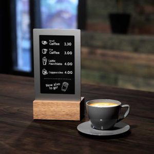 viewneo Diwa device on a wooden cafe table